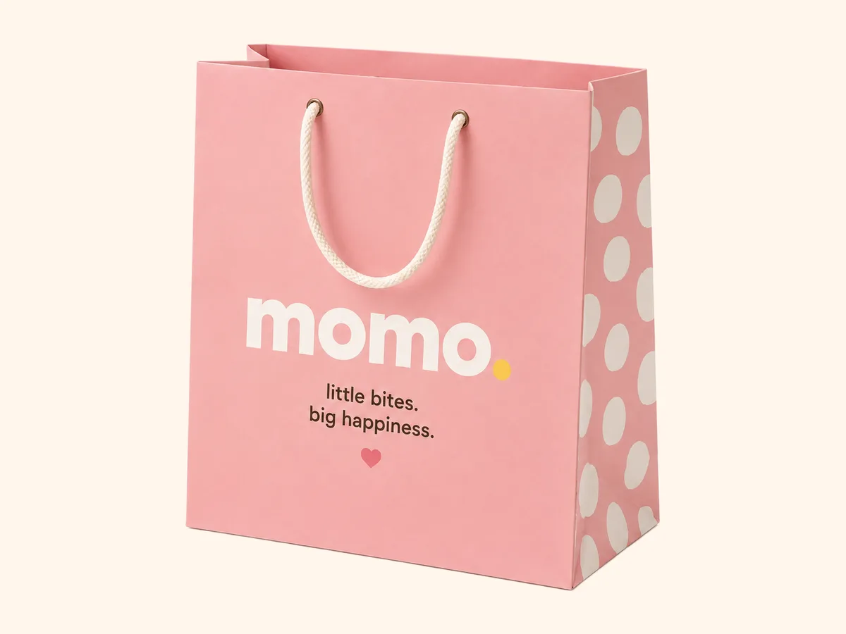 The pink carrier bag with the rope handle